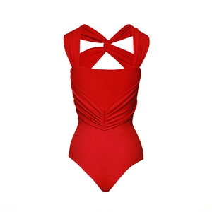 Detailed view of red ruched bodysuit featuring criss-cross twist shoulder strap design