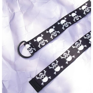 Detail of a punk skull printed nylon belt featuring high-quality black metal double D-rings