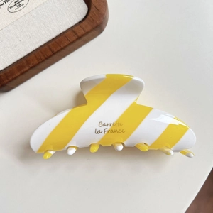 French vintage acetate hair claw clip with elegant yellow and white diagonal stripes
