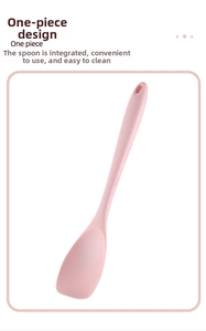 Detail of pink one-piece silicone salad spatula showing smooth edges and hanging hole