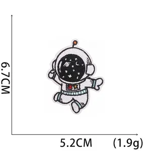 Cartoon astronaut embroidered patch with size 6.7x5.2cm showing starry helmet detail