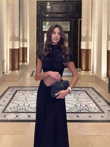 Chic black halter neck cutout dress with mesh detailing and ruched fitted skirt