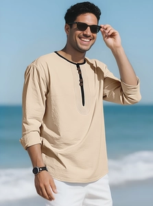 Detail of men's beige linen Henley shirt with black trimmed collar and three buttons