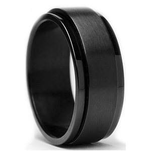Macro detail of men's matte black rotatable ring with brushed finish and polished edges