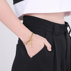 Double-layered gold stainless steel bracelet with cross pendant and OT toggle clasp closure