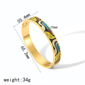 Detail view of 18k gold enamel wave bracelet with dimensions 65.2mm inner diameter