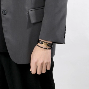 Men's multi-layer braided leather infinity bracelet with black beads and gold magnetic clasp