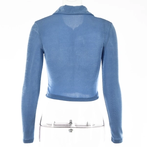 Rear view of a soft blue long sleeve cropped cardigan with pleated texture details