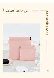 Close-up of pink PU leather storage pouches with squeeze metal spring closure for accessories