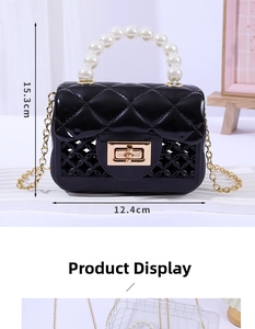 Close-up of mini jelly bag showing black quilted texture and 15.3cm height dimension