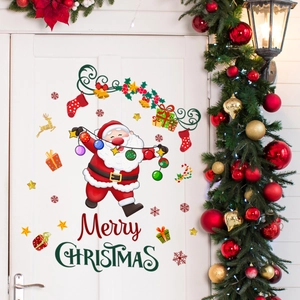 Festive Merry Christmas wall stickers with Santa, golden reindeer and snowflakes on a white door