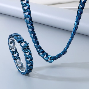 Detailed view of the blue stainless steel 15mm cuban link necklace and bracelet set