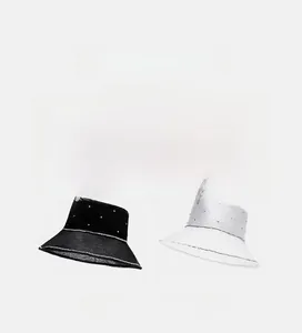 Collage of chic bucket hats in black and white with metal M logo and breathable mesh brim