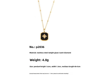 Macro detail of gold-plated stainless steel star charm with black enamel rectangle inlay