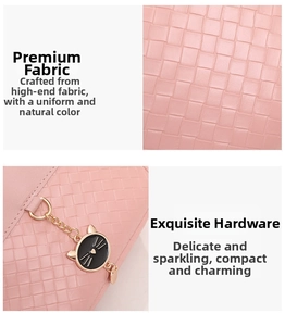 Close-up of pink woven texture fabric and golden cat charm with heart detail on bag