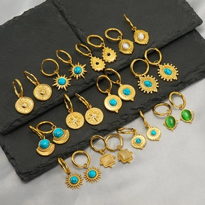 Bohemian gold stainless steel earrings set with turquoise and sunburst patterns