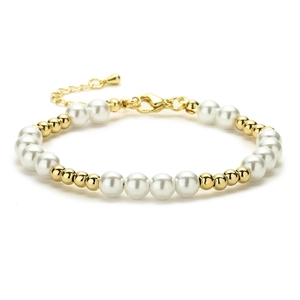 Elegant adjustable beaded bracelet with white pearls and gold metal spheres on white background
