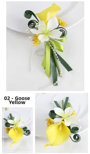 Detailed view of handmade groom boutonniere with yellow calla lily and pearl accents