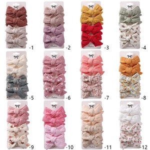 Detailed grid view of children cotton linen bow hair clip sets in various patterns and colors