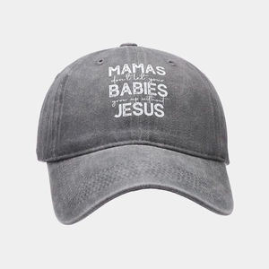 Detailed close-up of grey washed cotton baseball cap with white slogan text and curved brim