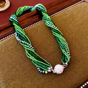 Multi-strand twisted green crystal bead necklace with sparkling rhinestone sphere clasp
