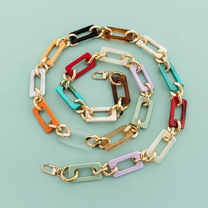 Close-up of colorful acrylic chain strap with gold clasps for bags and phone cases