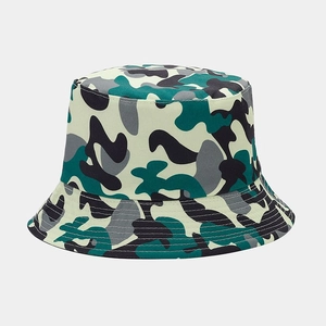 Detail of green camouflage bucket hat featuring reinforced stitching on canvas brim