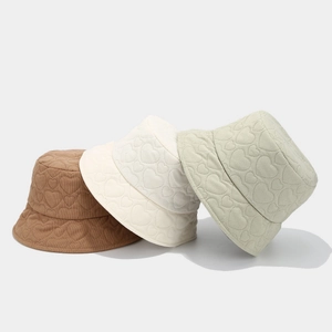 Winter corduroy bucket hat with heart quilting in brown, white and green colors