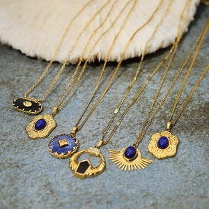 Detail of vintage French court necklaces with blue natural stones and 18K gold plating