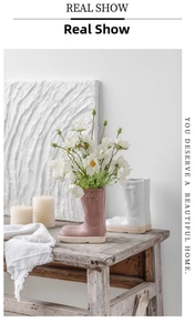 Creative boot-shaped ceramic vase on vintage wooden bench with daisy flowers for home decor