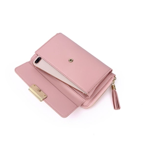 Pink PU leather crossbody phone bag with tassel detail and metal buckle closure