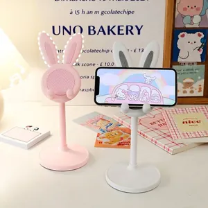 Adjustable cute bunny phone stand in pink and white for desktop and tablet
