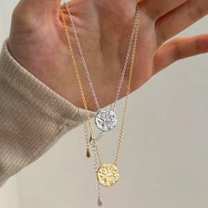 Elegant S925 sterling silver coin necklace featuring star patterns in gold and silver