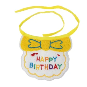 Detail view of yellow pet birthday bib with Happy Birthday embroidery and ribbon