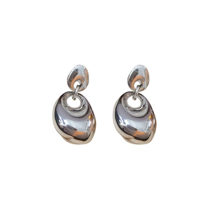 Minimalist silver irregular oval metal stud earrings with polished mirror finish on white background
