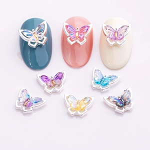 Colorful 3D gradient butterfly nail art charms with iridescent crystal stones for manicures
