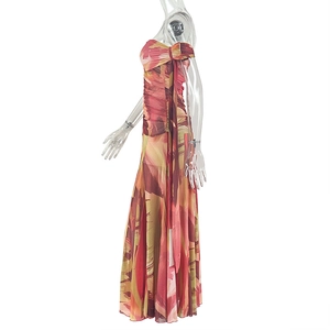 Detail of printed maxi dress with side ruching and asymmetric strap on white background