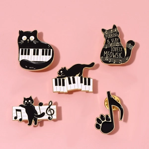 Cute black cat piano and music notes enamel brooch set on a soft pink background