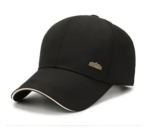 Detail of black sports baseball cap with metallic logo plate and contrast edge trim