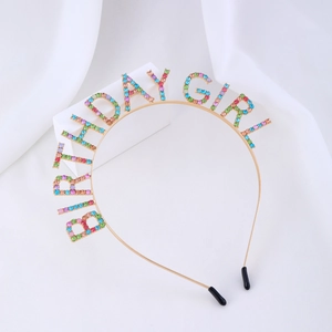 Sparkling birthday girl headband with colorful rhinestones on minimalist white background