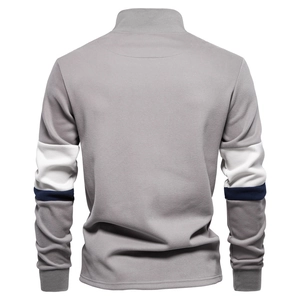 Close-up of gray long sleeve Polo sweatshirt with white and navy contrast stripes