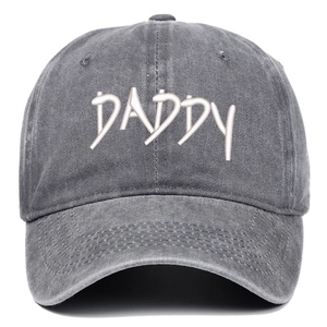 Close-up of white DADDY embroidery on vintage washed denim baseball cap in dark grey