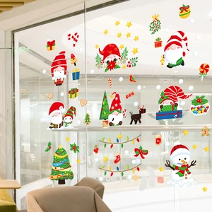 Detail of festive Christmas window stickers featuring Santa Claus and snowman motifs