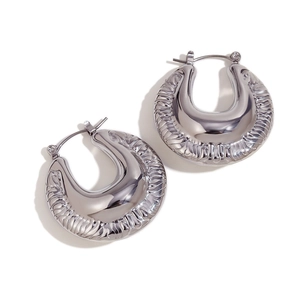 Exaggerated silver irregular textured hollow thick hoop earrings for women in trendy style