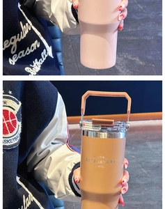 Close-up of insulated coffee mug with ergonomic grip handle and spill-proof lid