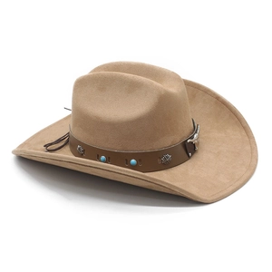 Detail of camel suede cowboy hat featuring leather band with turquoise and silver bull head