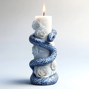 Macro view of detailed rose relief and blue snake texture on a white pillar candle