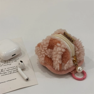 Detail of soft plush waffle velvet earphone pouch with pearl pendant and zip closure