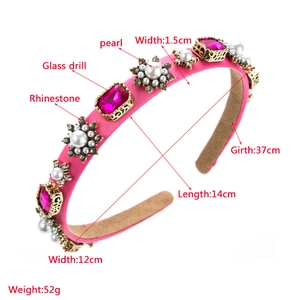 Detailed view of rose pink fabric headband with pearls, rhinestones and glass crystals