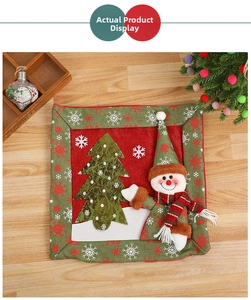 Detail of Christmas snowman pillow cover with textured applique and festive embroidery